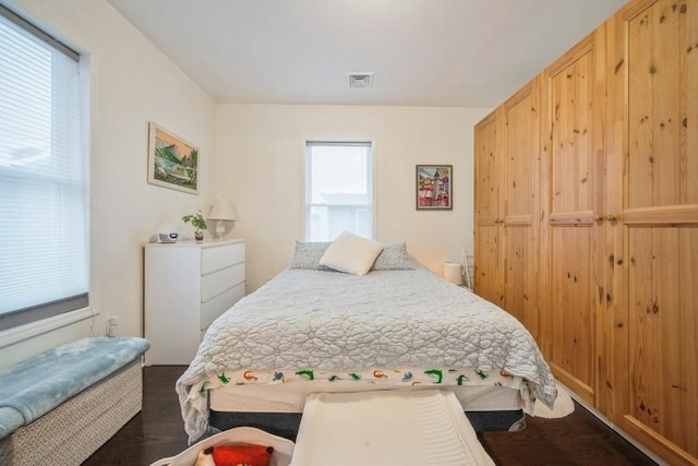 bedroom featuring dark hardwood / wood-style flooring