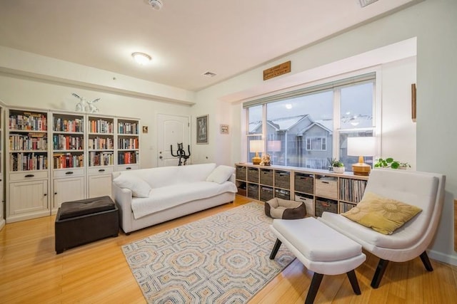 sitting room with light hardwood / wood-style flooring