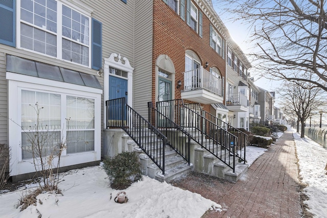 view of snow covered property entrance