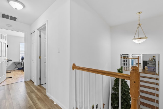 corridor featuring light hardwood / wood-style floors