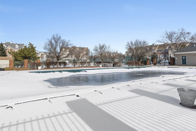 view of snow covered pool