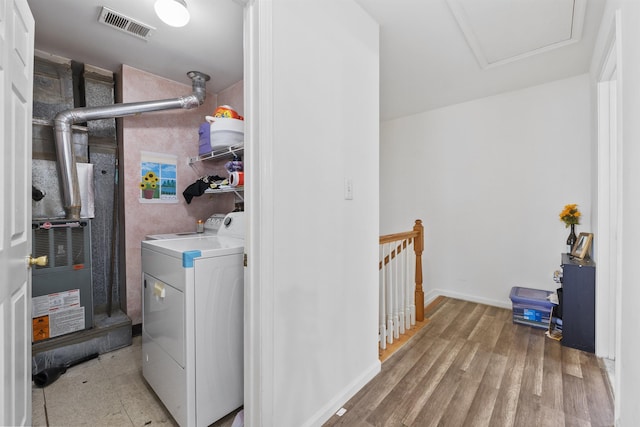 laundry room with light hardwood / wood-style floors