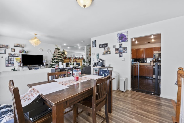 dining area with hardwood / wood-style flooring