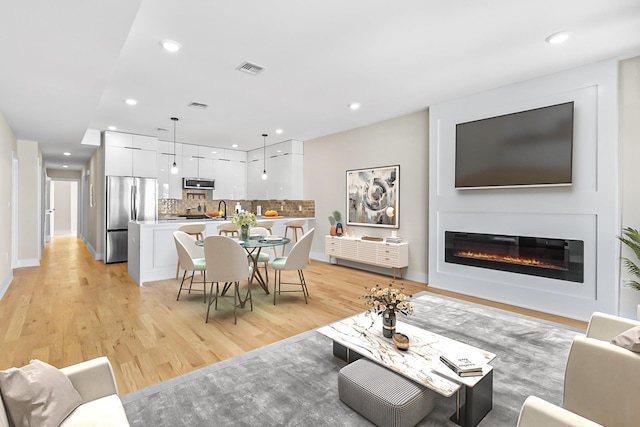 living room with light wood-type flooring