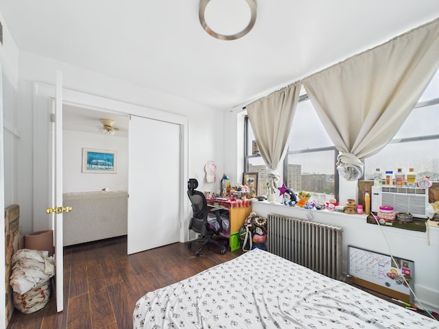 61 65th St Unit 10, West New York, NJ 07093 - bedroom featuring radiator and wood finished floors