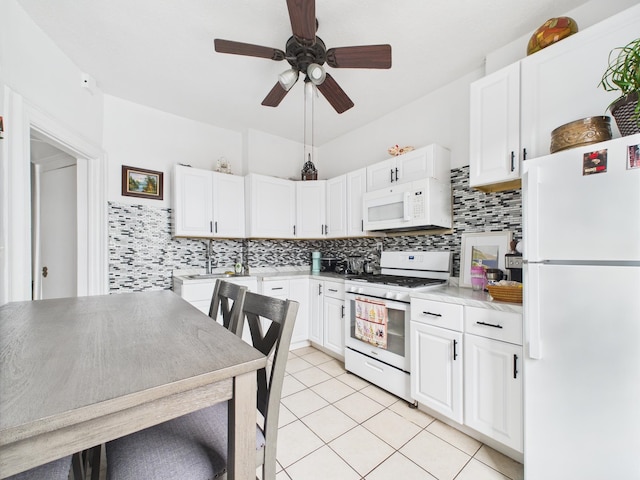 61 65th St Unit 10, West New York, NJ 07093 - kitchen with white appliances, tasteful backsplash, ceiling fan, and white cabinets
