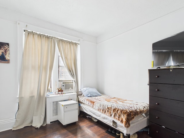 61 65th St Unit 10, West New York, NJ 07093 - bedroom with dark wood-style floors and cooling unit