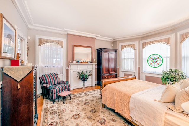 bedroom with multiple windows and crown molding