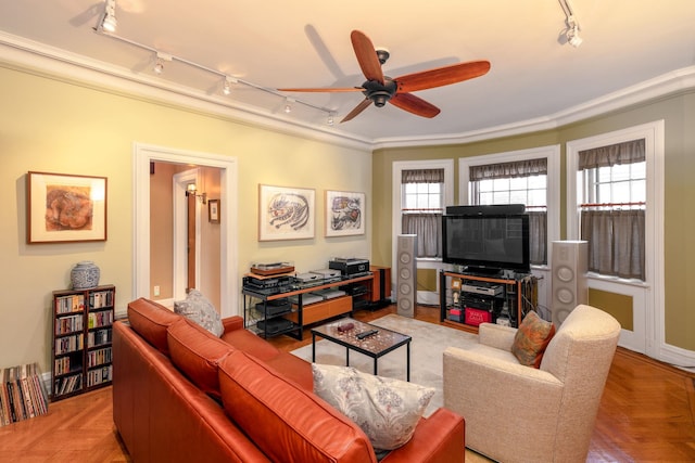 living room with crown molding, ceiling fan, a wealth of natural light, and light parquet floors