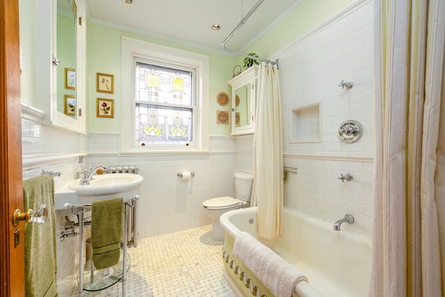 full bathroom with crown molding, tile walls, tile patterned flooring, toilet, and shower / bath combo with shower curtain