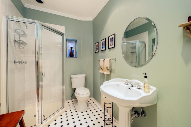 bathroom featuring a shower with shower door, ornamental molding, and toilet