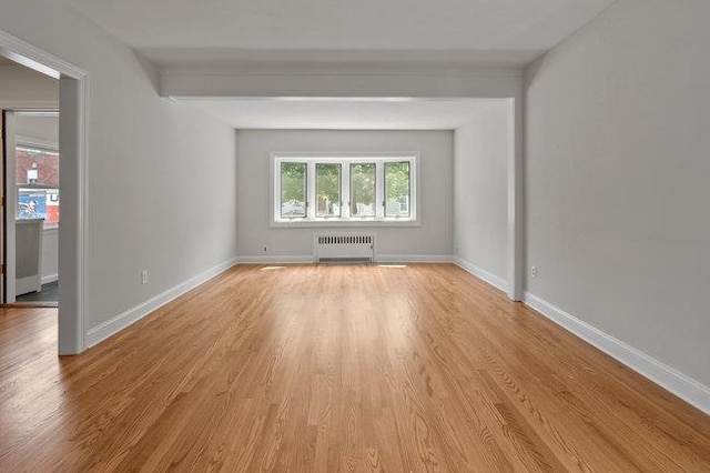 577 New Jersey Ave, Lyndhurst, NJ 07071 - empty room featuring radiator, light wood-style floors, and baseboards