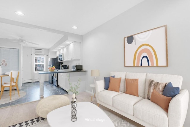 living room with wood finished floors, recessed lighting, and ceiling fan