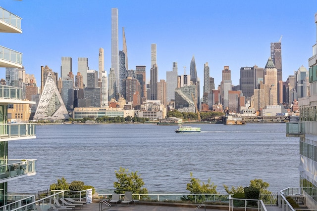 property's view of city featuring a water view