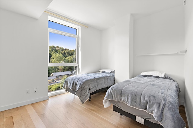 bedroom featuring light wood-type flooring