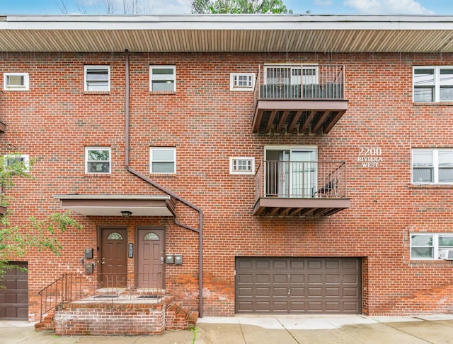 2200 Paterson Plank Rd Unit 23, North Bergen, NJ 07047 - view of property with an attached garage and concrete driveway