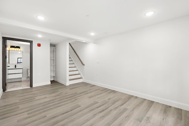 133 Clifton Pl Unit 3, Jersey City, NJ 07304 - finished basement with stairway, baseboards, recessed lighting, and light wood finished floors