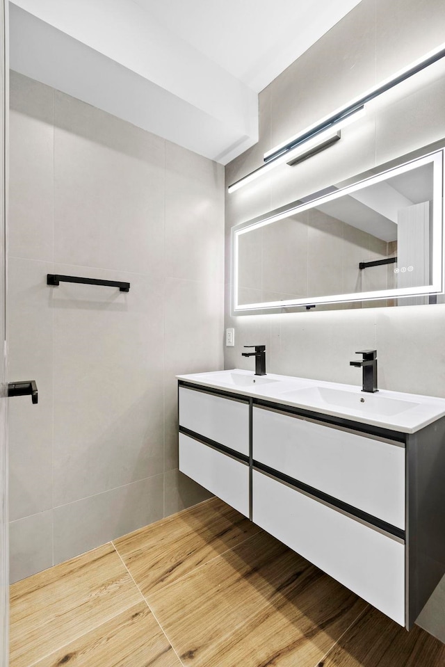 133 Clifton Pl Unit 3, Jersey City, NJ 07304 - bathroom with double vanity and tile walls
