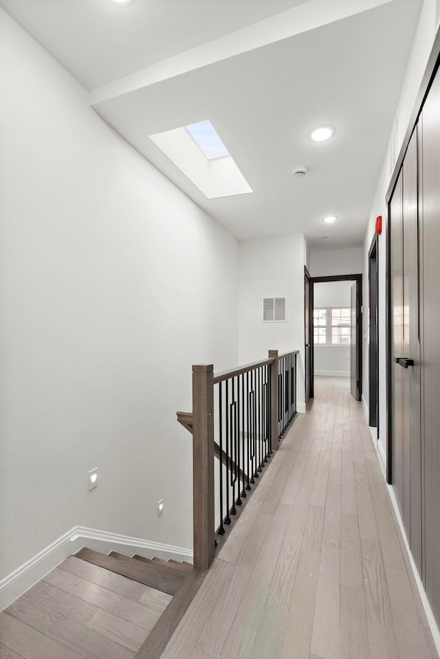 133 Clifton Pl Unit 3, Jersey City, NJ 07304 - hallway with a skylight, light wood-style floors, baseboards, and recessed lighting