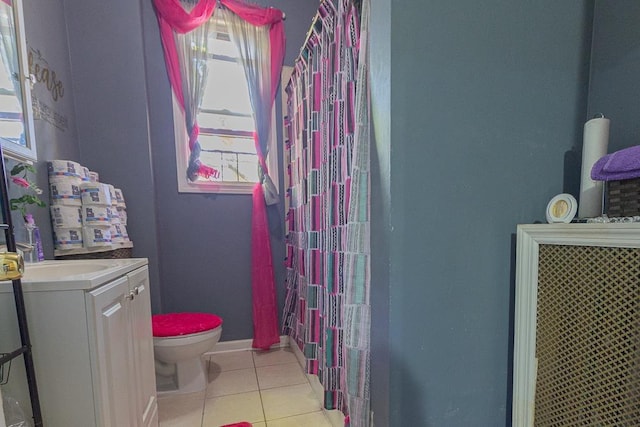 bathroom featuring walk in shower, tile patterned floors, toilet, and vanity