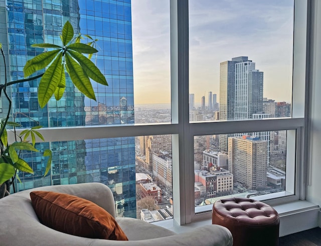 balcony at dusk featuring a city view