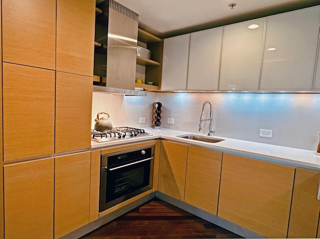 kitchen with open shelves, a sink, stainless steel appliances, light countertops, and tasteful backsplash