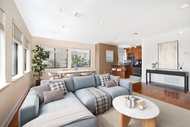 136 41st St Unit 103, Union City, NJ 07087 - living room featuring wood finished floors, recessed lighting, and baseboards