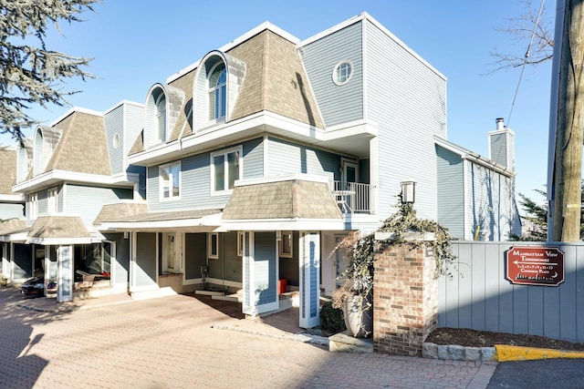 1 Columbus Pl Unit 1, Cliffside Park, NJ 07010 - view of front facade with a shingled roof and covered porch
