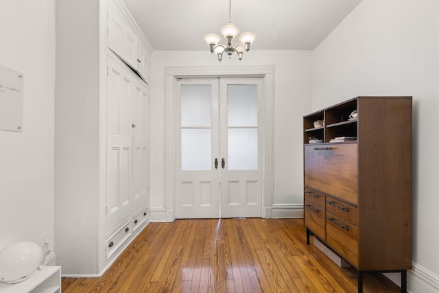 1114 Hudson St Unit 9, Hoboken, NJ 07030 - mudroom featuring hardwood / wood-style flooring, a chandelier, and baseboards