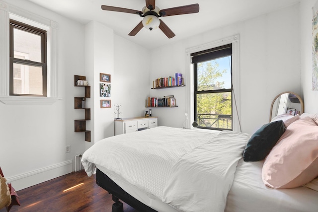 1114 Hudson St Unit 9, Hoboken, NJ 07030 - bedroom with dark wood-style flooring, baseboards, and ceiling fan