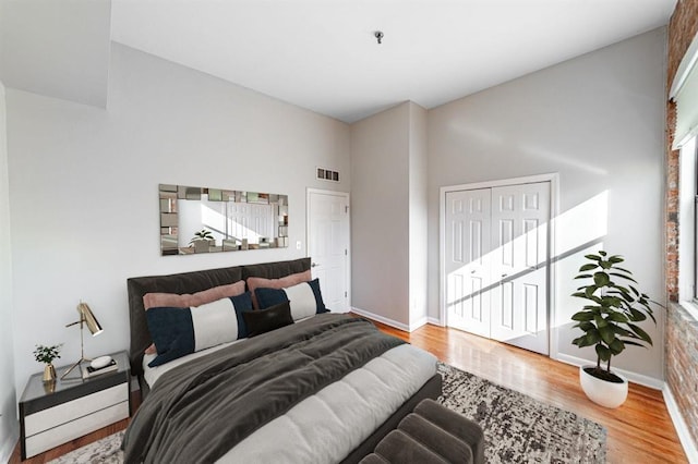 347 Varick St Unit 419A, Jersey City, NJ 07302 - bedroom featuring wood finished floors, baseboards, and a closet