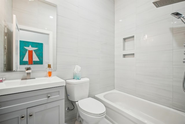98 Van Horne St Unit A, Jersey City, NJ 07304 - bathroom with tile walls, toilet, shower / tub combination, and vanity