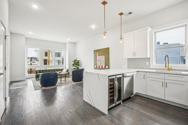 98 Van Horne St Unit A, Jersey City, NJ 07304 - kitchen featuring white cabinetry, a sink, tasteful backsplash, and dark wood-type flooring