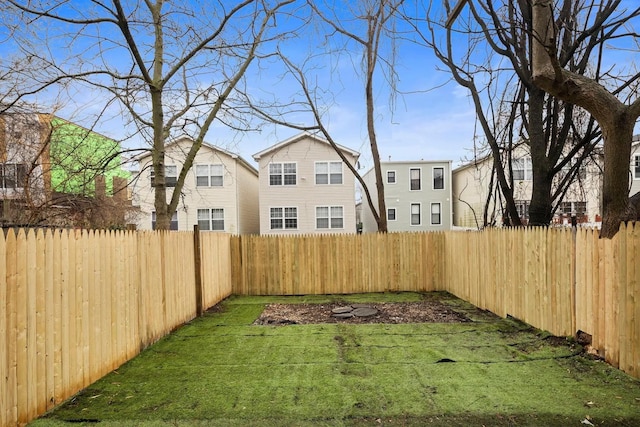 view of yard with a fenced backyard