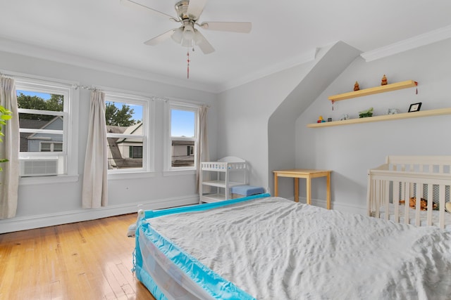 179 W 8th St, Bayonne, NJ 07002 - bedroom featuring ornamental molding, multiple windows, hardwood / wood-style flooring, baseboards, and a ceiling fan