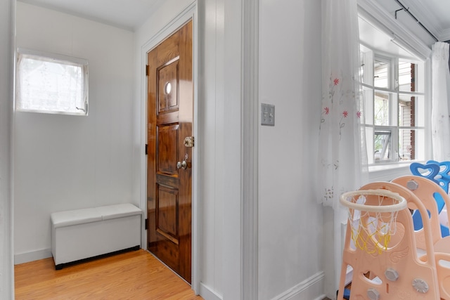 179 W 8th St, Bayonne, NJ 07002 - hallway featuring light wood finished floors and baseboards