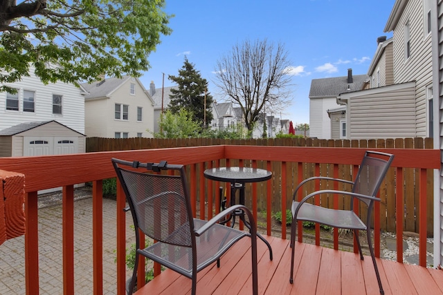 179 W 8th St, Bayonne, NJ 07002 - deck with a fenced backyard, a residential view, and a storage shed
