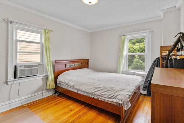 179 W 8th St, Bayonne, NJ 07002 - bedroom with light wood-style flooring, ornamental molding, and cooling unit