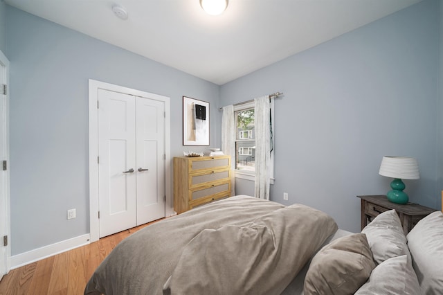 31 Ravine Ave Unit 1, Jersey City, NJ 07307 - bedroom with light wood-style floors, baseboards, and a closet