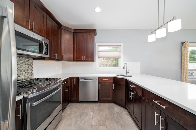31 Ravine Ave Unit 1, Jersey City, NJ 07307 - kitchen featuring appliances with stainless steel finishes, a sink, decorative backsplash, light countertops, and recessed lighting