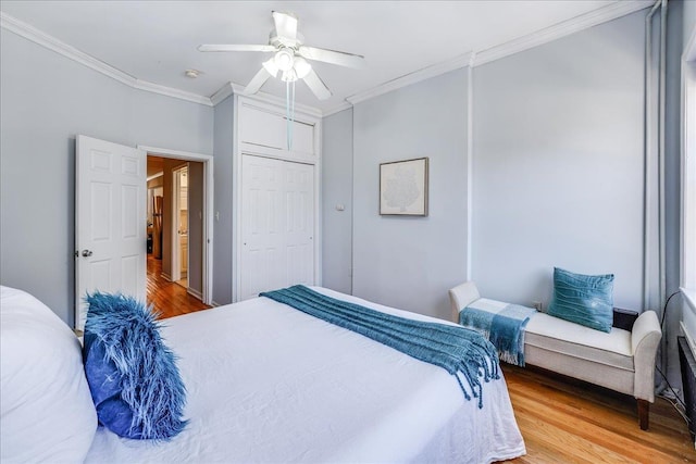 519 Willow Ave Unit 3, Hoboken, NJ 07030 - bedroom with wood finished floors, ornamental molding, a closet, and ceiling fan