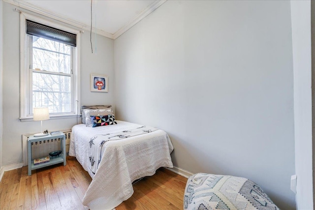 519 Willow Ave Unit 3, Hoboken, NJ 07030 - bedroom featuring ornamental molding, light wood finished floors, multiple windows, and baseboards