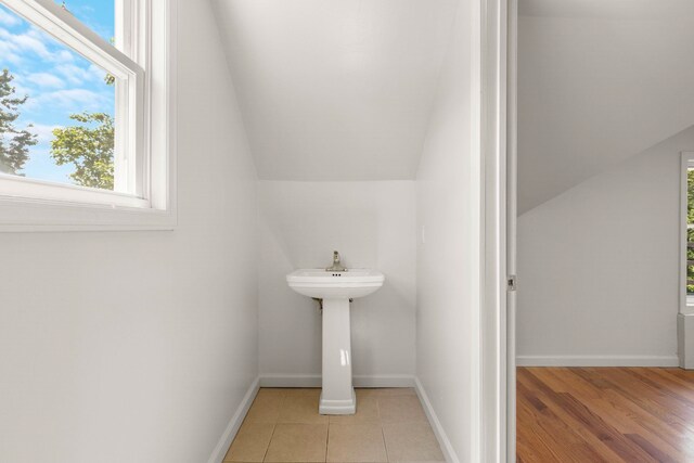195 Stanley Pl, Hackensack, NJ 07601 - bathroom with healthy amount of natural light and vaulted ceiling