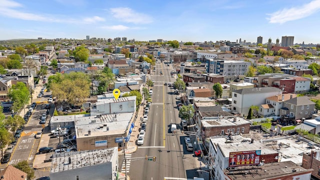 birds eye view of property with a view of city