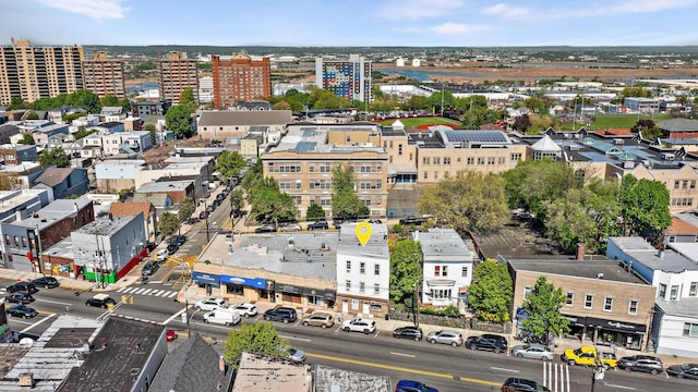 birds eye view of property featuring a city view