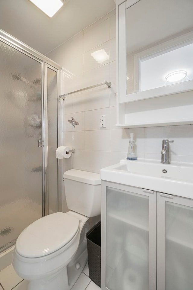 1224 80th St, North Bergen, NJ 07047 - full bathroom with tile walls, vanity, a shower stall, and tile patterned flooring