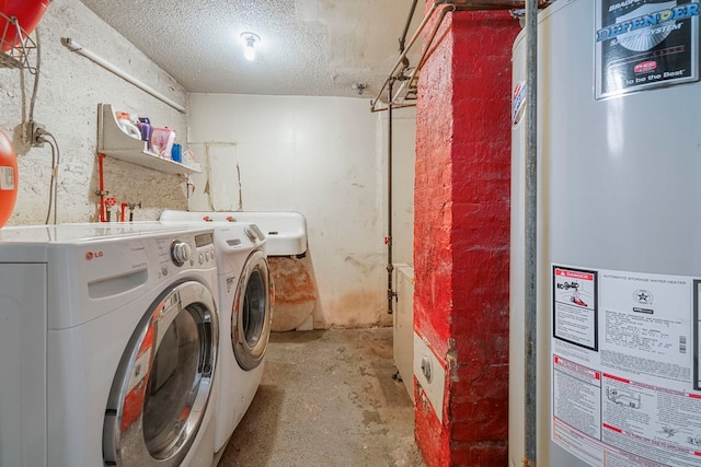 1224 80th St, North Bergen, NJ 07047 - washroom featuring gas water heater, washer and dryer, and a textured ceiling