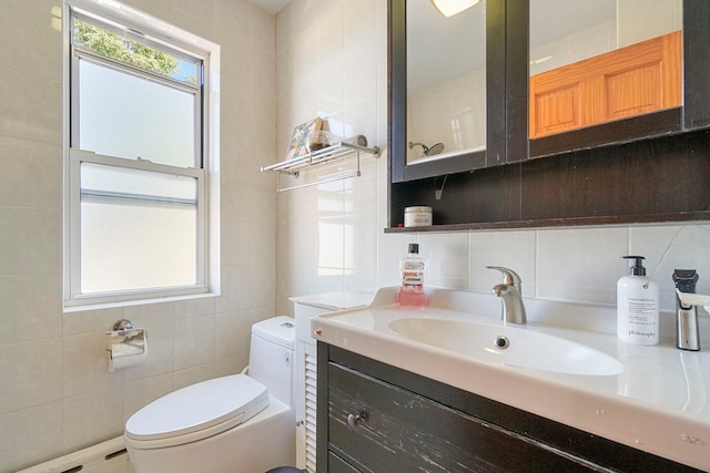1224 80th St, North Bergen, NJ 07047 - bathroom with tile walls, vanity, and decorative backsplash