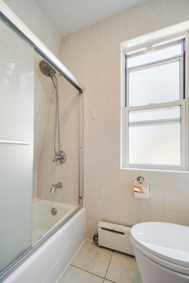 1224 80th St, North Bergen, NJ 07047 - bathroom featuring tile walls, baseboard heating, enclosed tub / shower combo, and tile patterned floors