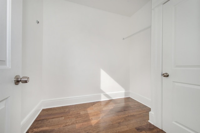 walk in closet featuring dark wood-type flooring